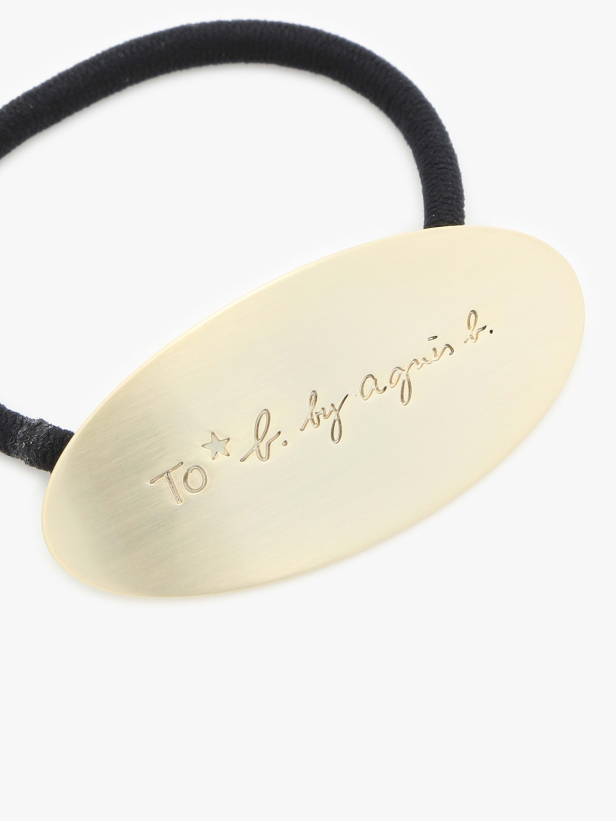 To b. by agnès b. メタル ロゴ ヘアタイ ゴールド