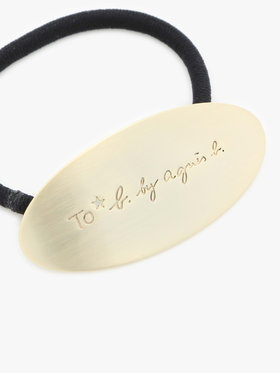 To b. by agnès b. メタル ロゴ ヘアタイ ゴールド